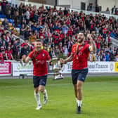 Brown (right) celebrates after York's play-off win over Boston