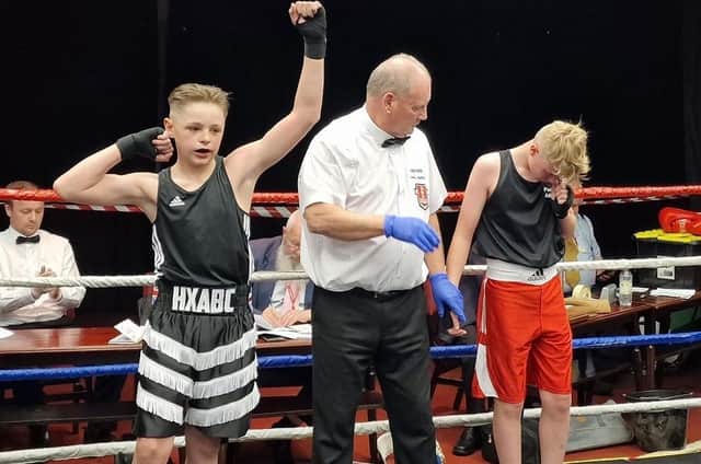 Halifax Boxing Club's Jimmy Honey celebrated an impressive win in Sheffield in only his second fight for the club.