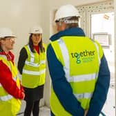 MPs Lisa Nandy and Holly Lynch talking to Dave Procter, Chair of the Together Housing Group Board in a Beech Hill property