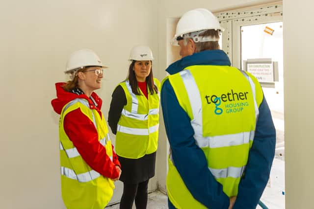MPs Lisa Nandy and Holly Lynch talking to Dave Procter, Chair of the Together Housing Group Board in a Beech Hill property