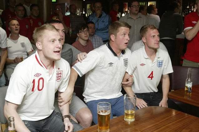 Fans watch England's first game in Euro 2012 v France at Maggie's, Halifax.