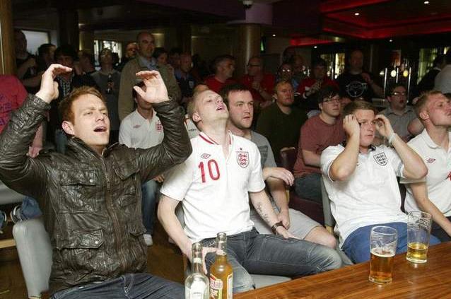 Fans watch England's first game in Euro 2012 v France at Maggie's.
