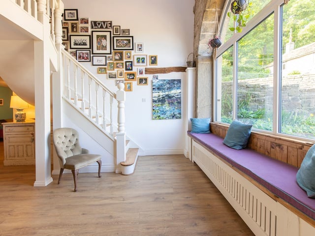 A window seat is a lovely feature in the spacious hallway.