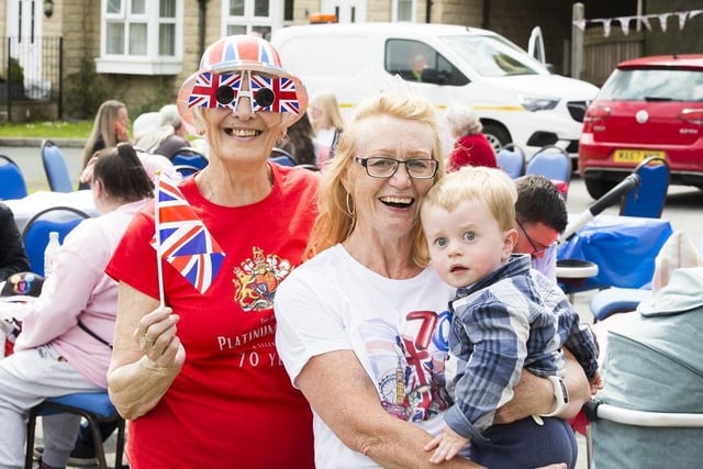 Platinum Jubilee Street party at Illingworth Moor Methodist Church. From the left, Georgie Stirrat and Sandy Hall with her grandson Joseph Tennant, two.