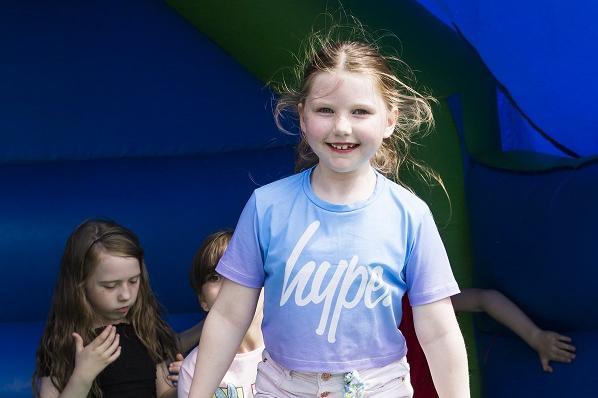 Platinum Jubilee Street party at Illingworth Moor Methodist Church. Isabelle Brady, eight, has a go on a bouncy castle.