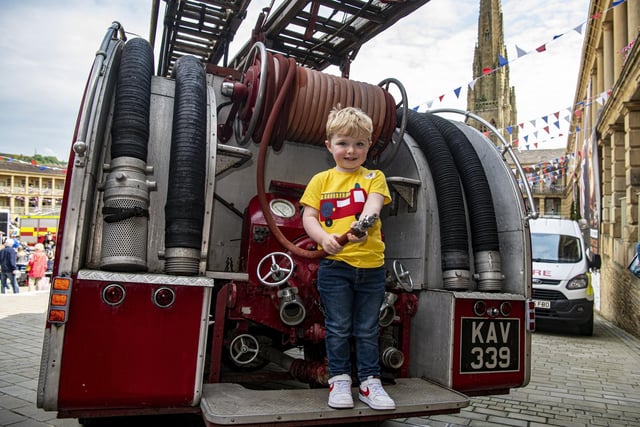 Theodore Lumb, three, with vintage fire engine at the emergency services day. Picture by Tony Johnson