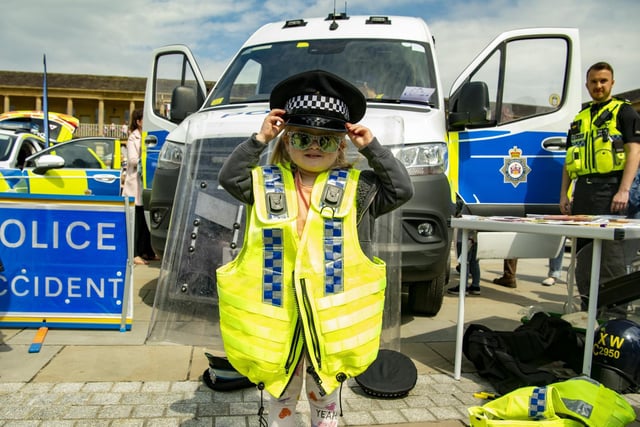 Bethany Stead, three, in police uniform at The Piece Hall emergency services day. Picture Tony Johnson
