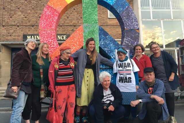 Activists from Calder Valley CND for Peace & Justice and Extinction Rebellion with Angie Zelter (kneeling, centre) and Dr Rowland Dye (kneeling right)