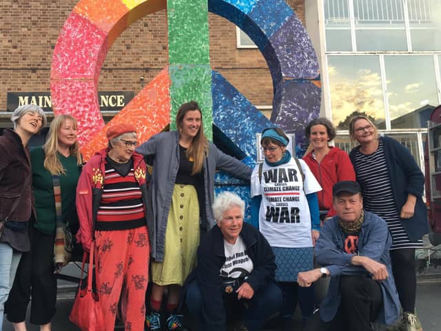 Activists from Calder Valley CND for Peace & Justice and Extinction Rebellion with Angie Zelter (kneeling, centre) and Dr Rowland Dye (kneeling right)