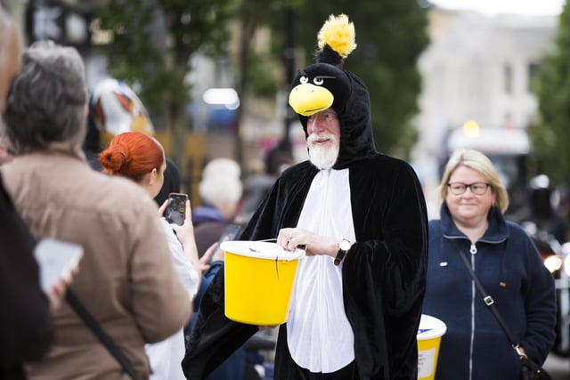 David Horsfall from Halifax Boys Brigade gets dressed up to collect donations during the procession through Halifax town centre.