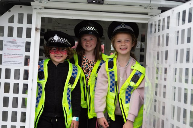 Mia and Max St Hilaire with Ava Linn were given the chance to dress up as police officers and take a look inside a police van