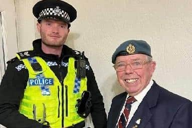 Sergeant Joshua Allgood from Halifax Neighbourhood Policing Team with the veteran and his beret