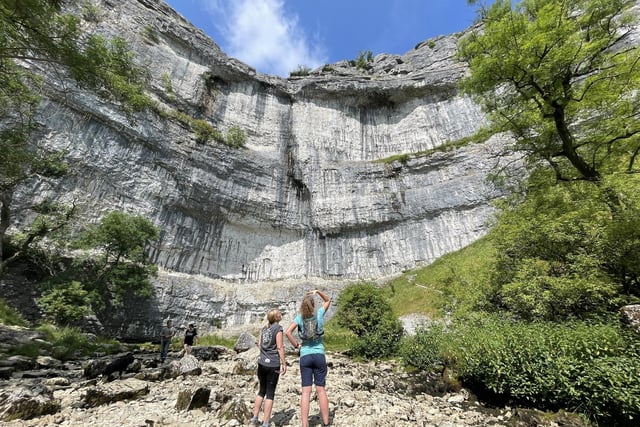 Malham Cove, North Yorkshire
The tourist attraction, in Malham, is a huge curving amphitheatre-shaped cliff formation made up of limestone rock. It is a well-known beauty spot and a popular place to visit