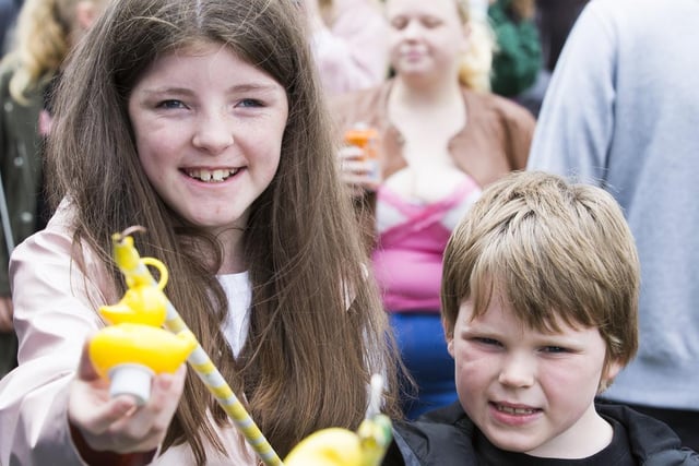 Alyssia Holroyd, 11, and Aidan Holroyd, nine, have a go at hook a duck