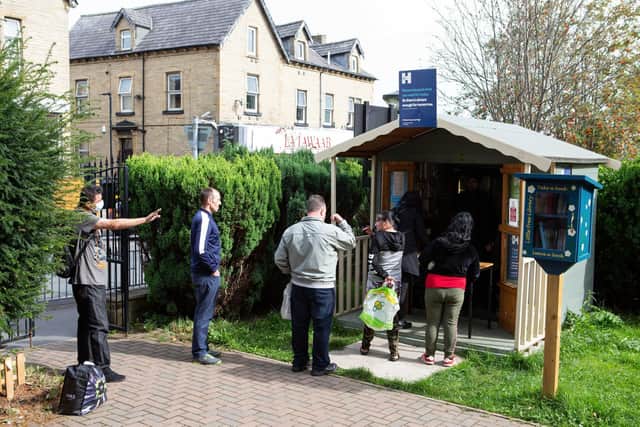 People queue outside Halifax Community Fridge every day