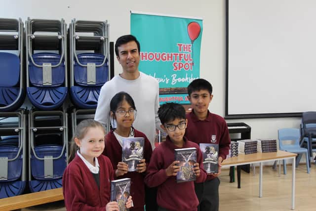 Pupils at Savile Park Primary School in Halifax with author Soman Chainani
