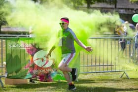 One of the runners getting covered in brightly-coloured paint