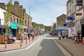 The current view of Commercial Street in Brighouse, including a parklet