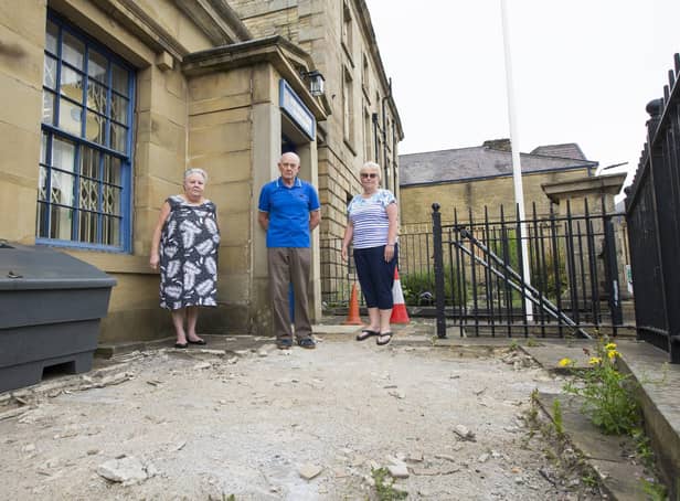 With the area flagstones were stolen from at Halifax Royal British Legion, from the left, Pauline Dawson, Michael Green and Susan Green.