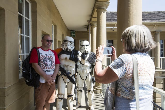 Audrey Cooper takes a photo of son Darren Cooper with some stormtroopers.