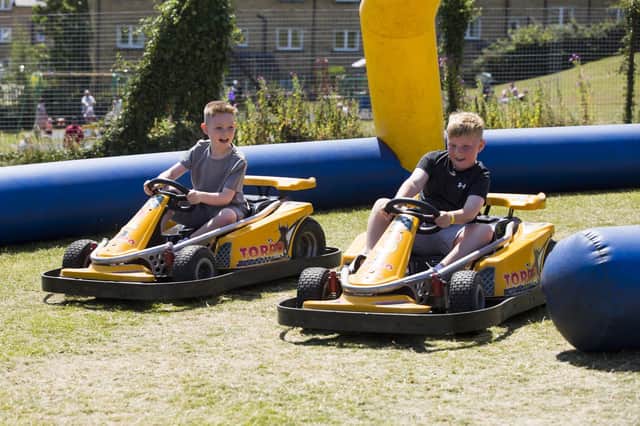 Freddie Eastwood, eight (left), and Frankie Agus, eight, on the go-karts.