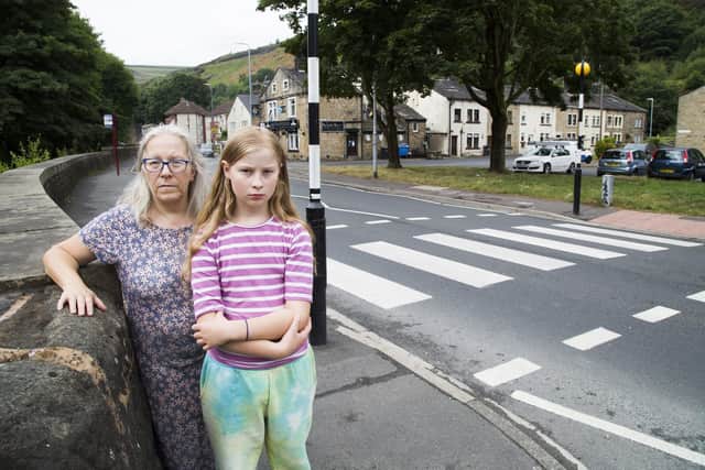 Clare Townley and her daughter Millie at the crossing where she was knocked down