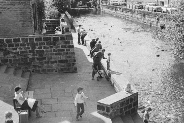 Hebden Bridge Residents enjoying time by the water in 1982.