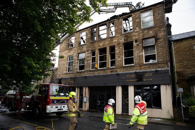 Firefighters at the scene of the fire in Hebden Bridge yesterday