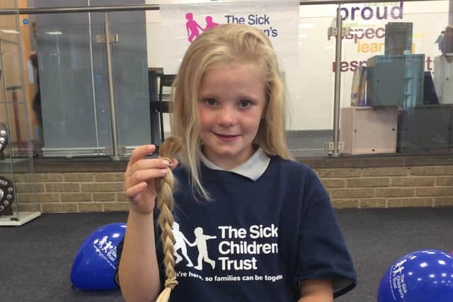 Charlie had her hair cut off to raise funds