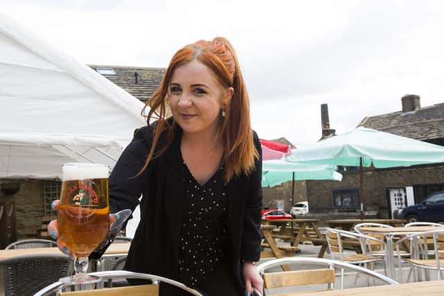 The Duke of York pub car park at Shelf has been converted into a beer garden ready to re-open. Manager Holly Branscombe is pictured.