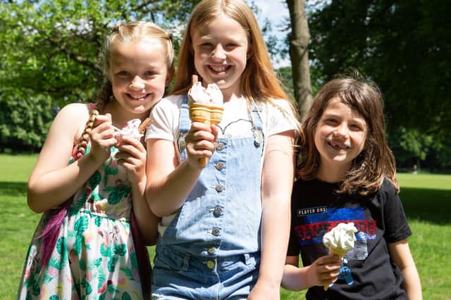 Enjoying the heatwave with ice creams, Raia and Anai Thomas, with Jona Milner, at Manor Heath, Halifax