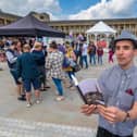 Poet Keiron Higgins reading at the Great Get Together event at the Piece Hall, Halifax