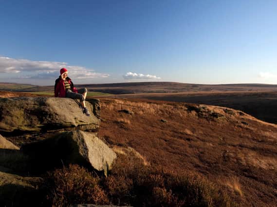Walker takes a rest to admire the South Pennine’s unique landscape. Picture: Steve Morgan.