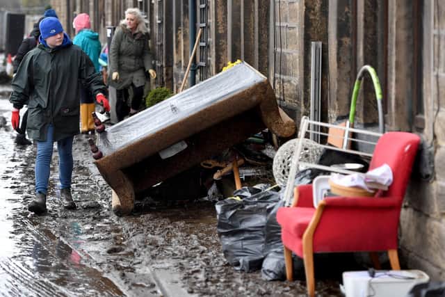 Residents begin clearing up following severe flooding beside the River Calder on February 10, 2020 in Mytholmroyd, West Yorkshire, England. (Photo by Anthony Devlin/Getty Images)
