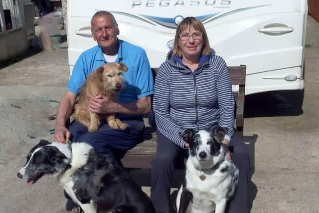 Jayne, her husband Geoff and their dogs.