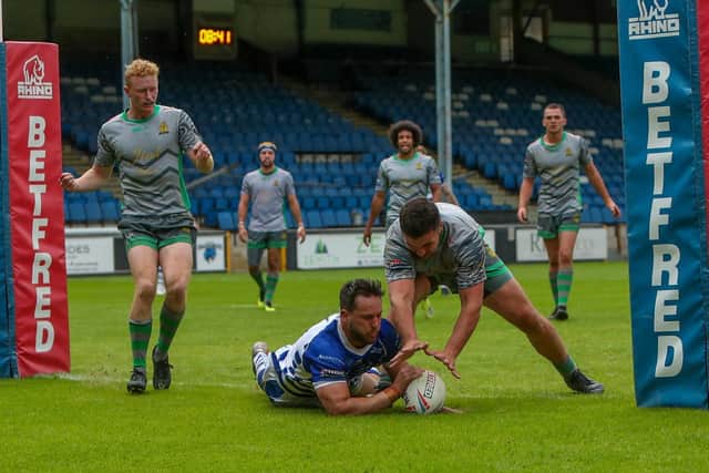 Curtis Davies dives in for Halifax Panthers' opening try in the 14-4 win over Whitehaven. Picture: simonomhrugbypics.