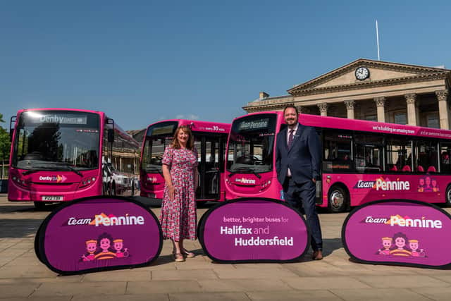Coun. Kim Groves, Chair, West Yorkshire Bus Alliance, with Transdev CEO Alex Hornby and the first three buses to carry the new Team Pennine livery