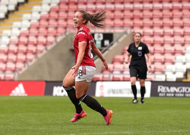 LEIGH, ENGLAND - MAY 09: Kirsty Hanson of Manchester United celebrates after scoring her team's second goal during the Barclays FA Women's Super League match between Manchester United Women and Everton Women at Leigh Sports Village on May 09, 2021 in Leigh, England. Sporting stadiums around the UK remain under strict restrictions due to the Coronavirus Pandemic as Government social distancing laws prohibit fans inside venues resulting in games being played behind closed doors. (Photo by Charlotte Tattersall/Getty Images)