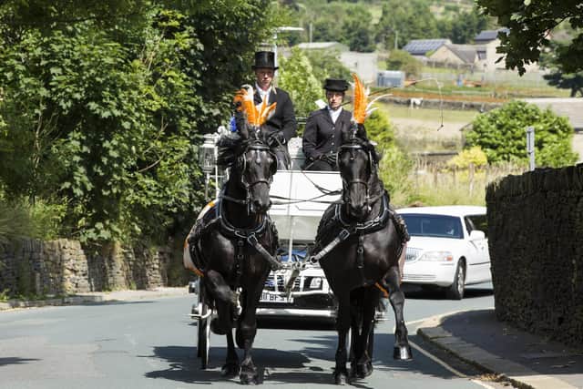 A horse-drawn carriage led the funeral cortege for Travis Smith.