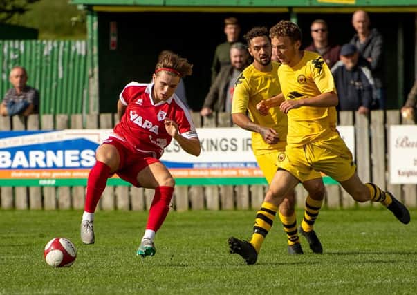 Jamie Cooke in action for Colne