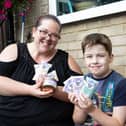 Emma Smith, trying to raise money by selling wax products, to buy a dog for her son Max, 10-years-old, who has autism