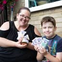 Emma Smith, trying to raise money by selling wax products, to buy a dog for her son Max, 10-years-old, who has autism
