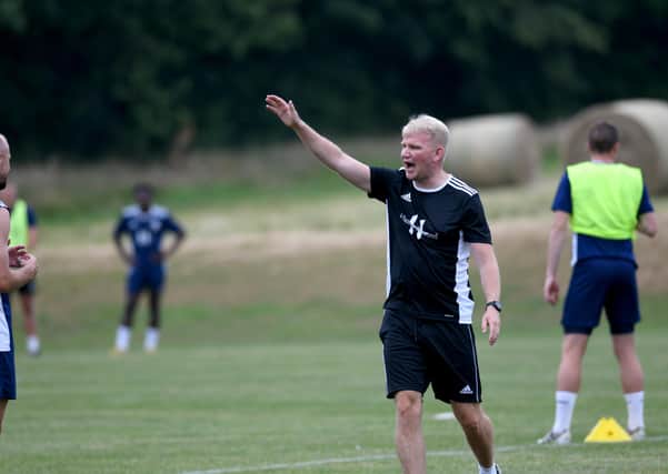 Halifax Town  manager Pete Wild   making a point at pre season training in Leeds.