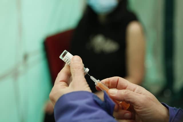 A coronavirus vaccine. (Photo by Hollie Adams/Getty Images)
