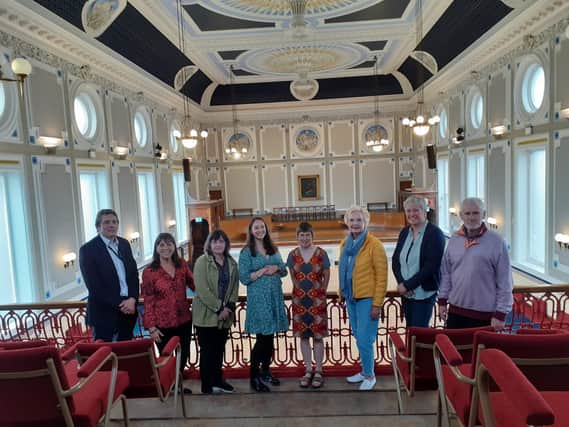 Todmorden Town Hall Working Group members in the refurbished ballroom at Todmorden Town Hall