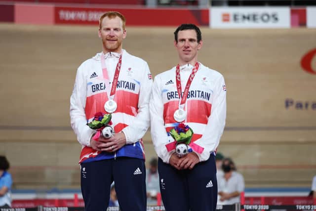 Silver medal winners Stephen Bate and pilot Adam Duggleby of Team Great Britan react during the medal ceremony for track cycling Men’s B 4000m Individual Pursuit Final on day 1 of the Tokyo 2020 Paralympic Games  (Photo by Kiyoshi Ota/Getty Images)