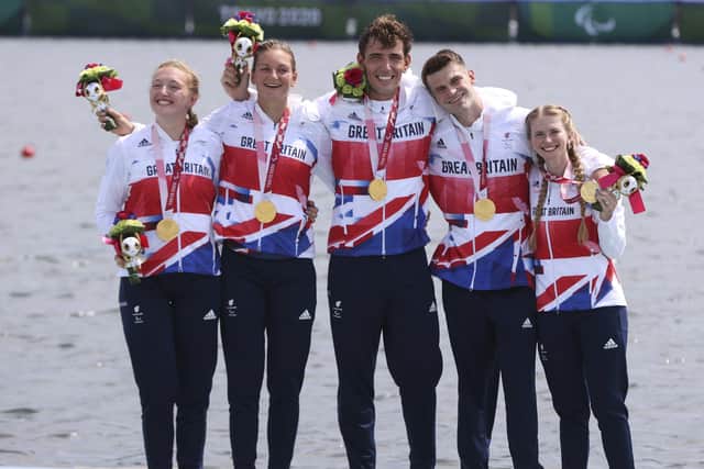 GB Rowers, Ellen Buttrick, left, Giedre Rakauskaite, James Fox, Oliver Stanhope and Cox Erin Kennedy celebrate winning gold in the PR3 Mixed Coxed Four in Tokyo. Picture: imagecomms/ParalympicsGB/PA