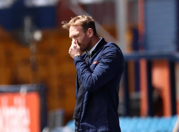 STOCKPORT, ENGLAND - MAY 16: Simon Rusk, manager of Stockport County reacts during the Vanarama National League match between Stockport County and Torquay United at Edgeley Park on May 16, 2021 in Stockport, England. Sporting stadiums around the UK remain under strict restrictions due to the Coronavirus Pandemic as Government social distancing laws prohibit fans inside venues resulting in games being played behind closed doors. (Photo by Jan Kruger/Getty Images)