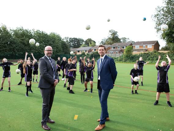 Celebrating the completion of the new multi-sports pitch at Rastrick High School are Steve Evans, CEO of Polaris Multi Academy Trust and Mat Williams, Head of School