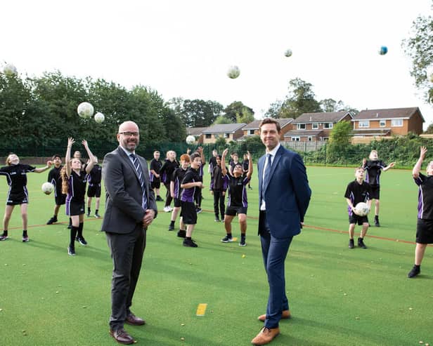Celebrating the completion of the new multi-sports pitch at Rastrick High School are Steve Evans, CEO of Polaris Multi Academy Trust and Mat Williams, Head of School